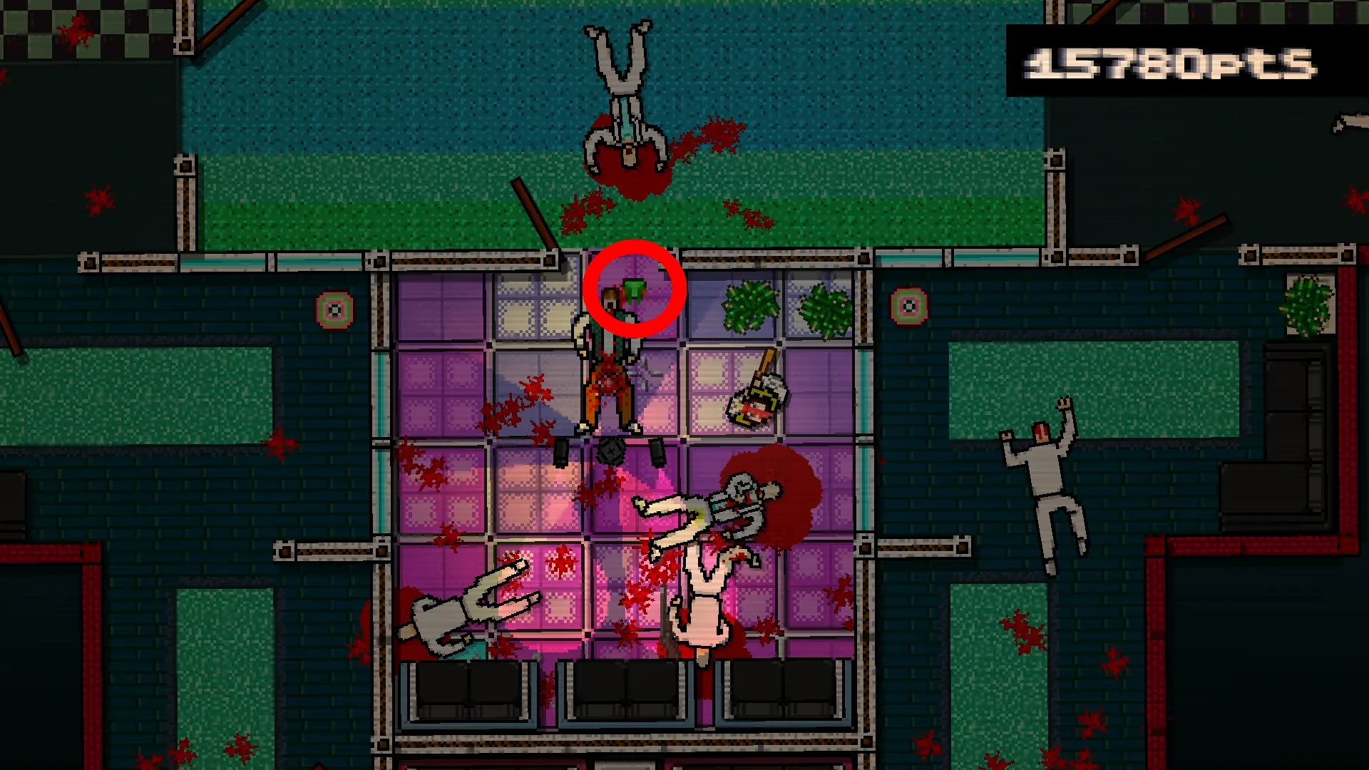 Hotline Miami screenshot showing a body near a grasshopper mask on the dancefloor